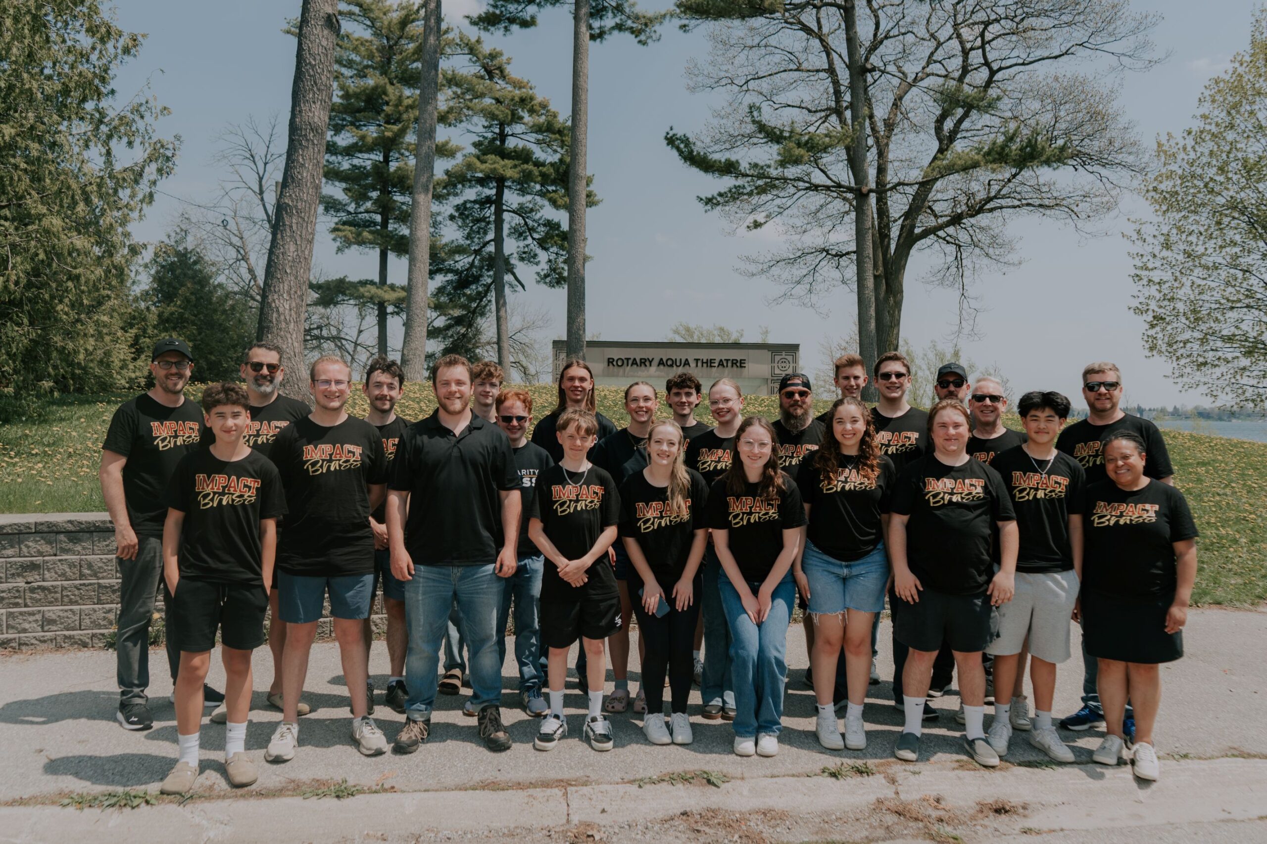 impact brass group photo at park